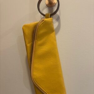 Yellow Leather Clutch with brown bracelet